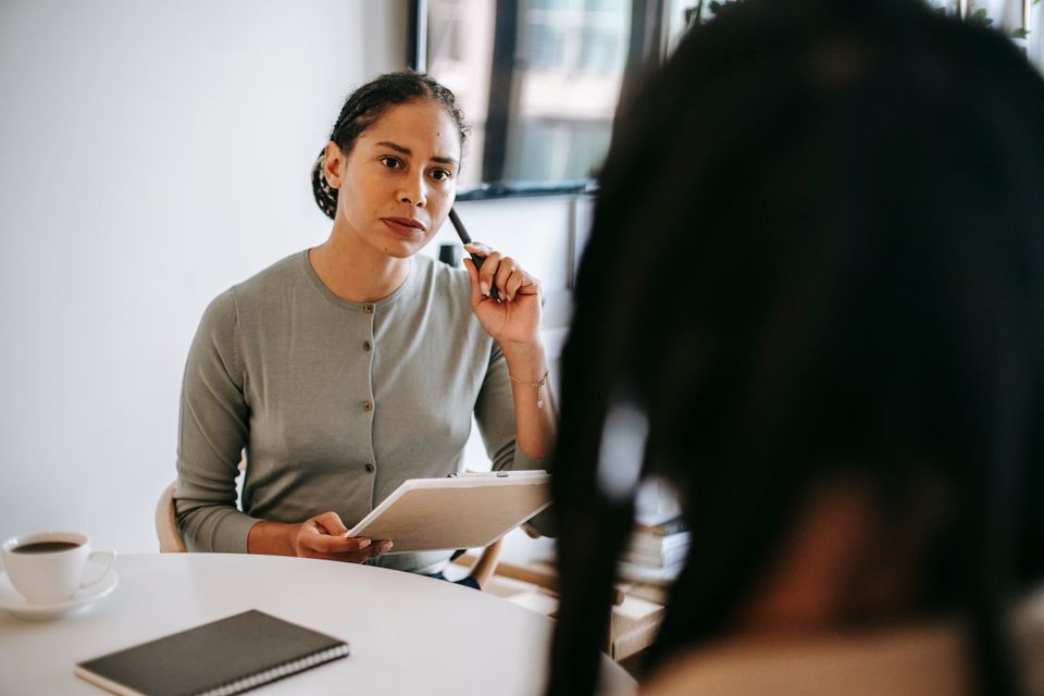 A counselor listening attentively during a one-on-one conversation
